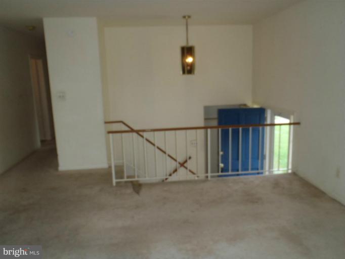 1318 Gatefield Road Catonsville, MD 21228 - Photo 8 of 14 a view of empty room with stairs