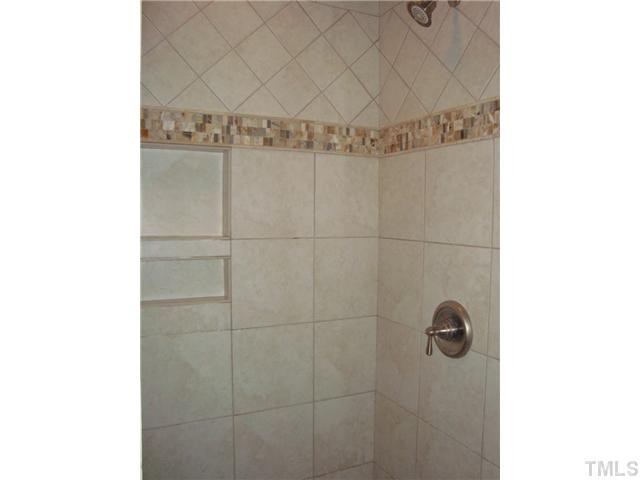 1417 Acres Way Raleigh, NC 27614 - Photo 16 of 25 This view of the master bath shows the tile detail in the shower. It also has a new glass door! Master Bath/Spa