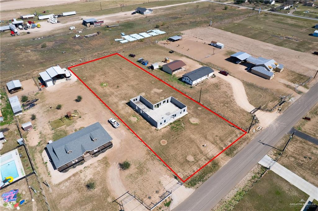 10406 Crocosmia Lane Edcouch, TX 78538 - Photo 2 of 6 an aerial view of a house with a big yard