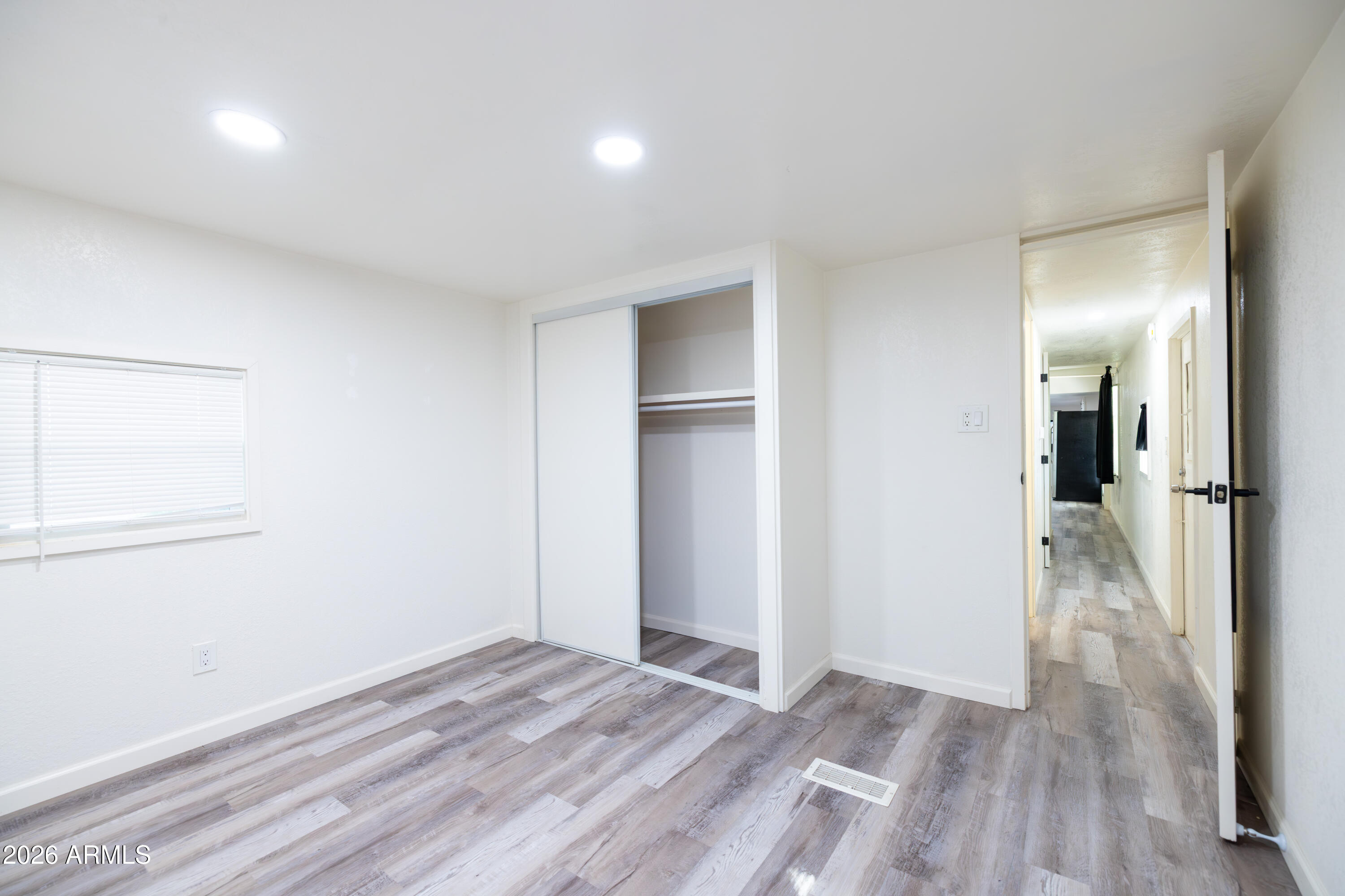 535 South Alma School Road, Unit 17 Mesa, AZ 85210 - Photo 12 of 17 a view of a room with wooden floor