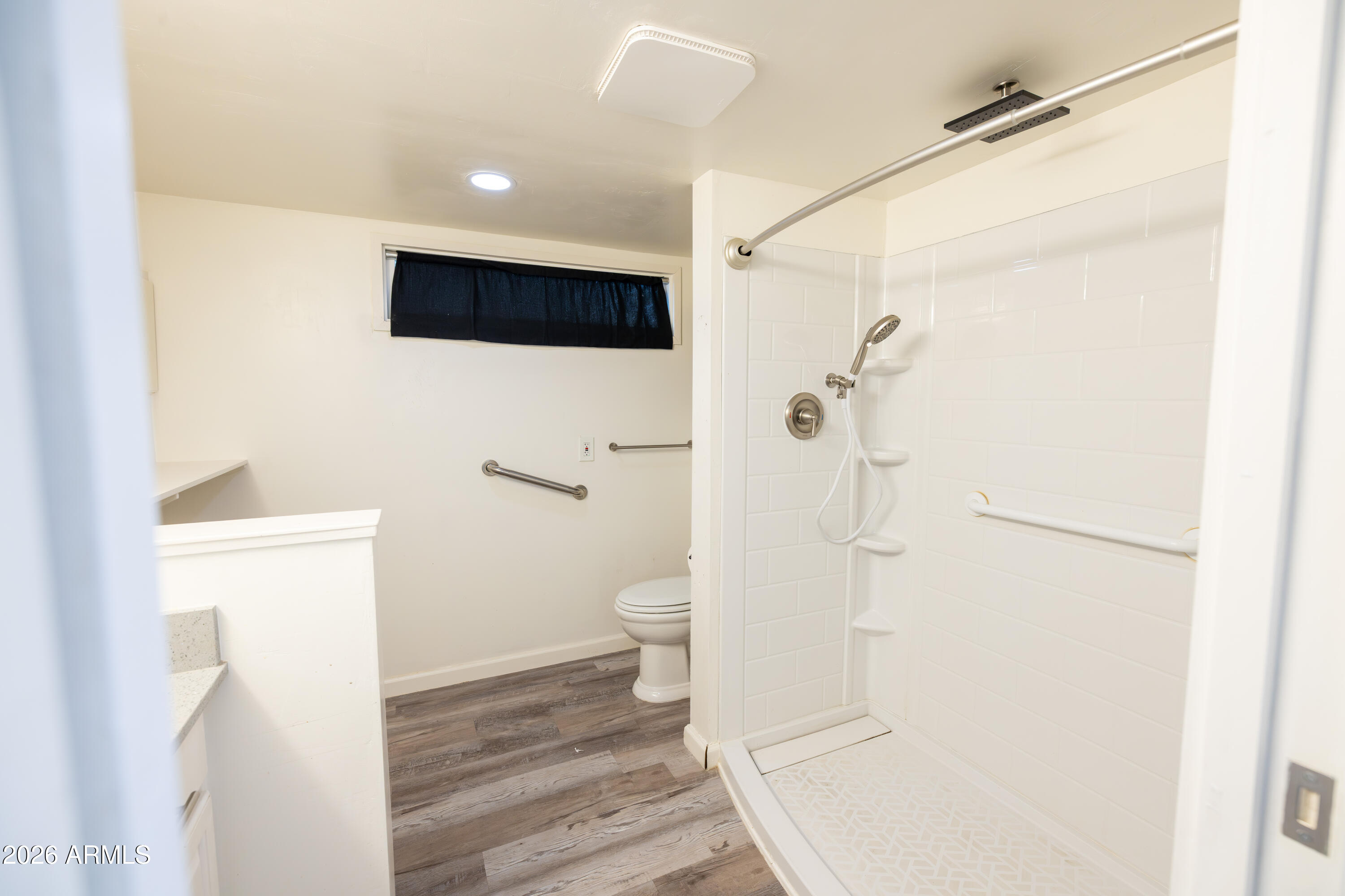 535 South Alma School Road, Unit 17 Mesa, AZ 85210 - Photo 15 of 17 a bathroom with a toilet a sink and a shower