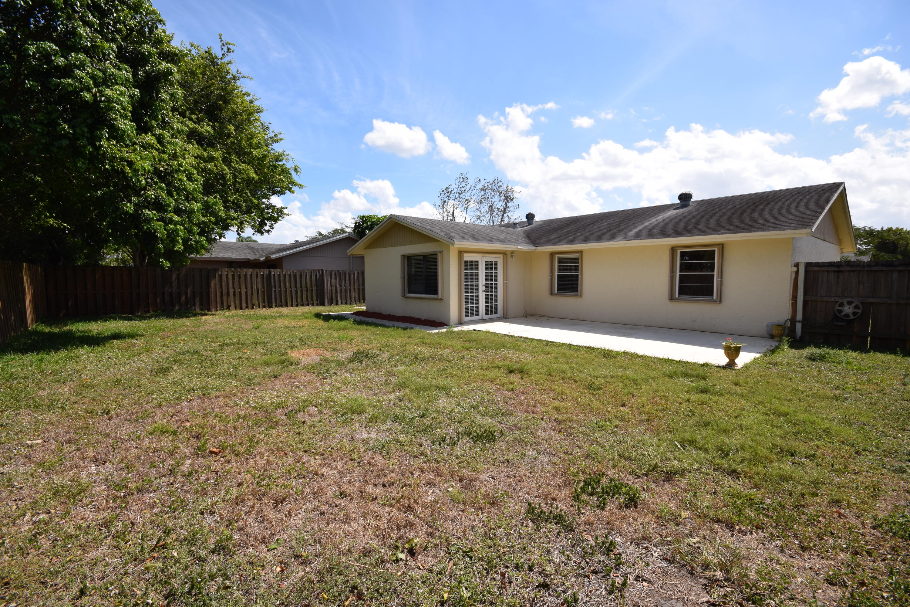 9129 Affirmed Lane Boca Raton, FL 33496 - Photo 12 of 12 a view of a house with a backyard