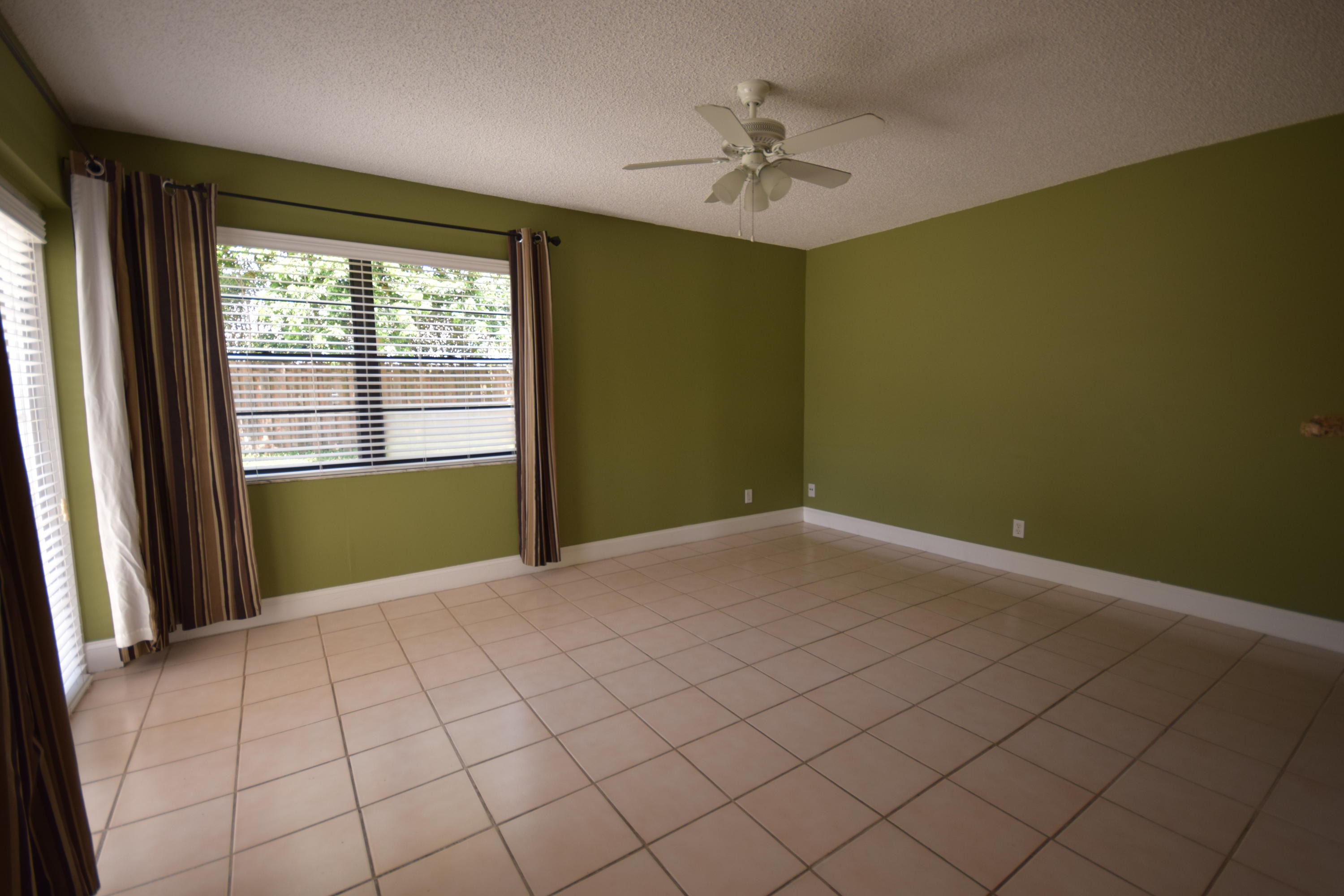 9129 Affirmed Lane Boca Raton, FL 33496 - Photo 6 of 12 a view of an empty room and window