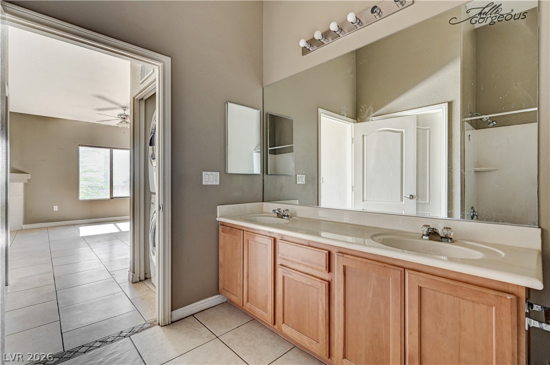 8985 South Durango Drive, Unit 2187 Las Vegas, NV 89113 - Photo 33 of 73 Double vanities and ample counter space create a functional and appealing primary bathroom.