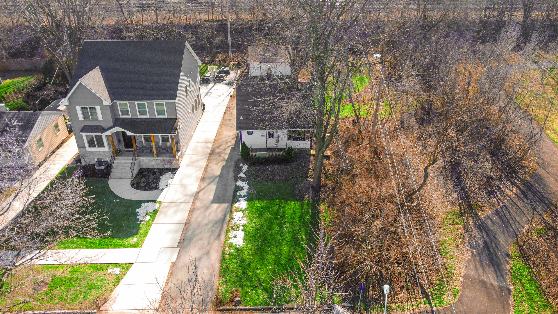 a aerial view of a house with yard swimming pool and outdoor seating