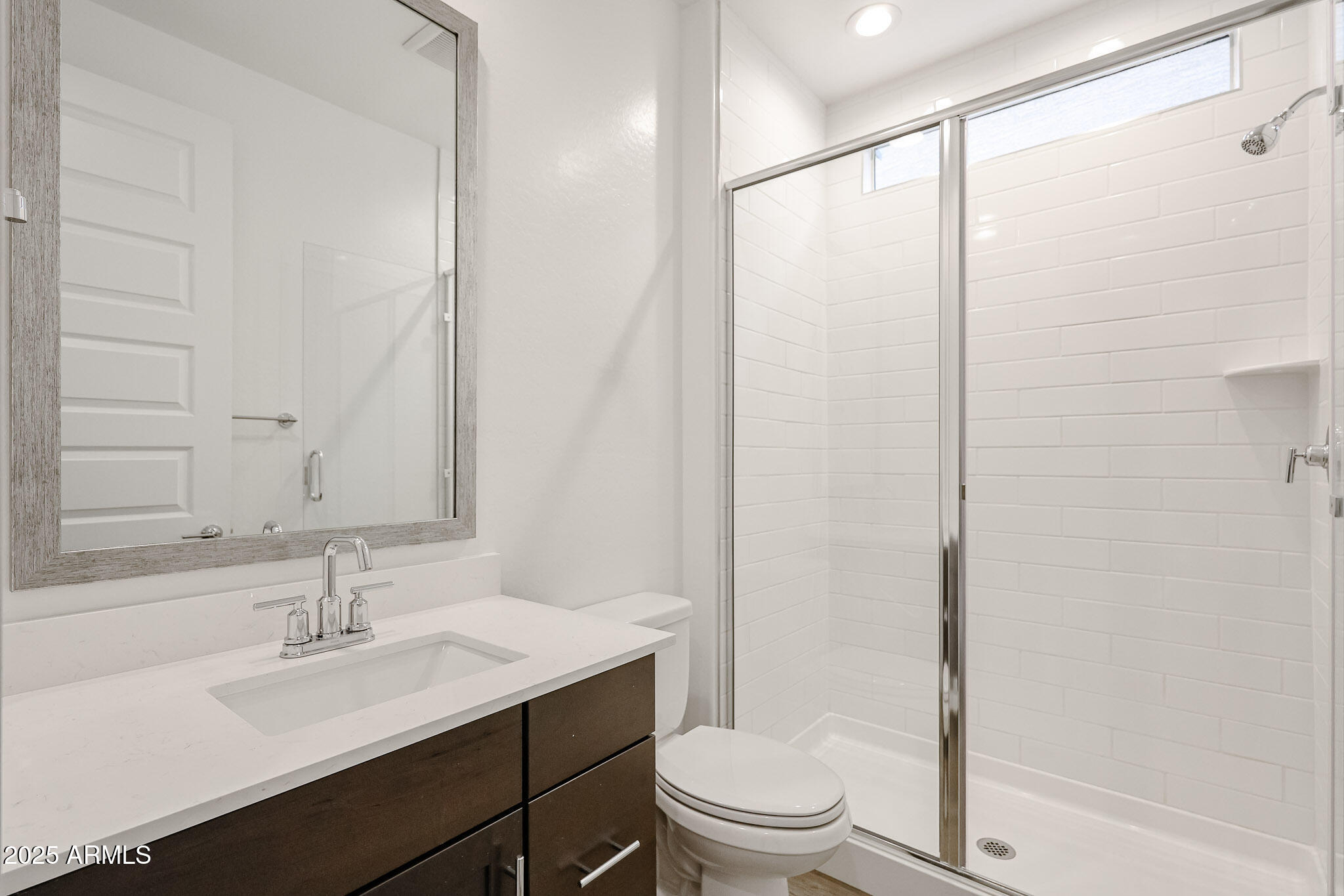 12526 West Morten Avenue Glendale, AZ 85307 - Photo 13 of 27 a bathroom with a sink and a mirror