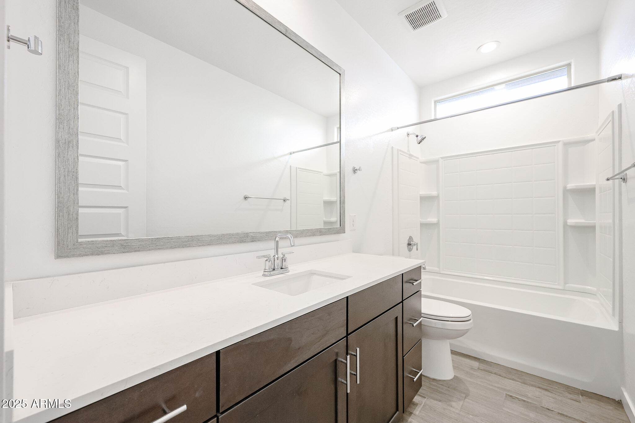 12526 West Morten Avenue Glendale, AZ 85307 - Photo 20 of 27 a bathroom with a sink a toilet and shower