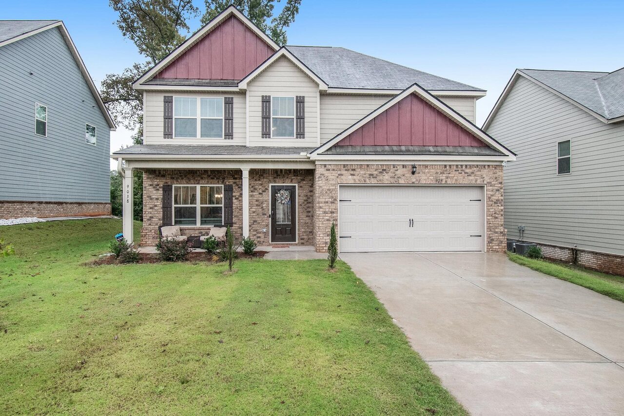 9038 Holder Road Locust Grove, GA 30248 - Photo 1 of 1 a view of a house with a yard