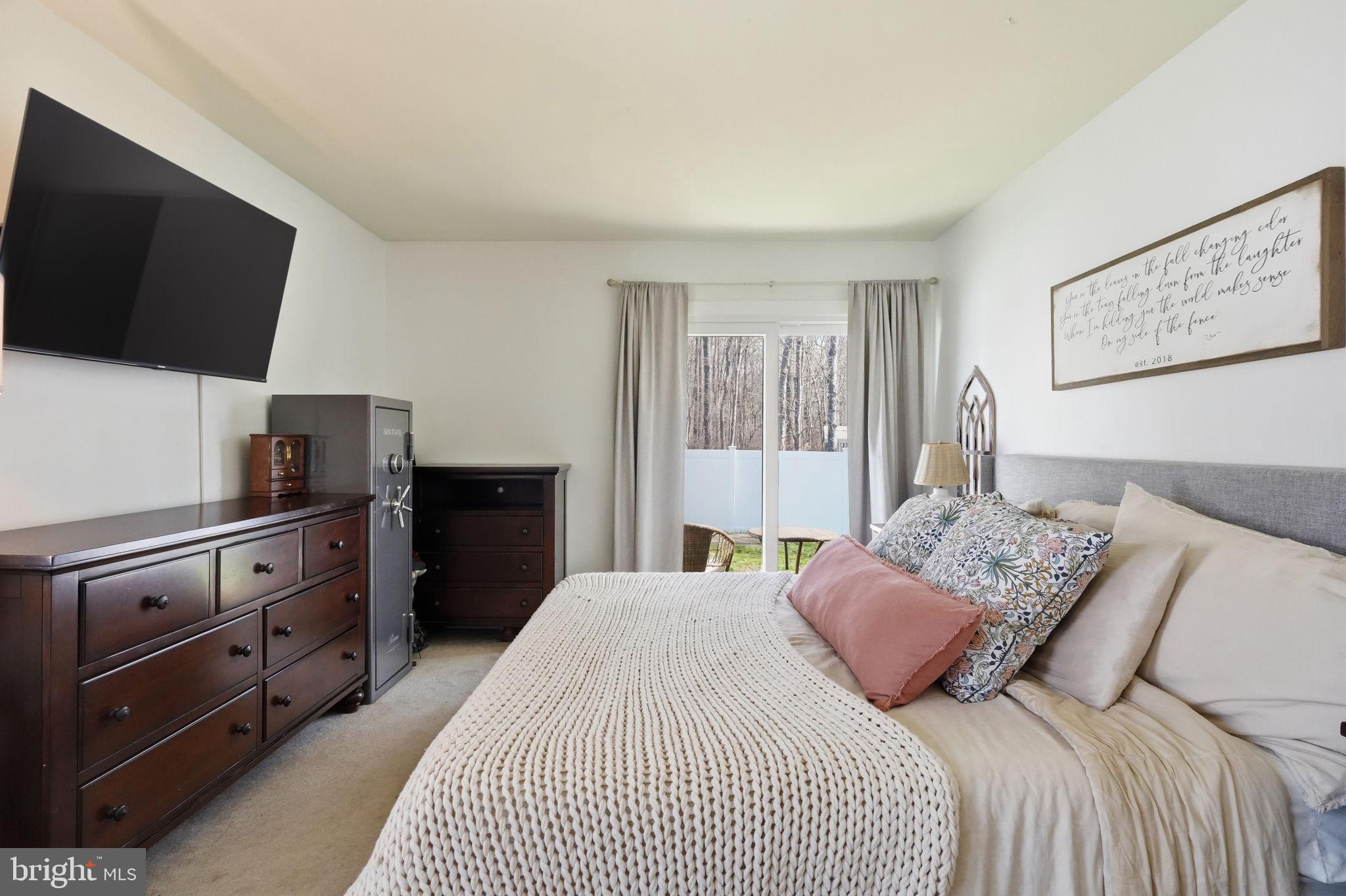 15 Deans Rhode Hall Road Monmouth Junction, NJ 08852 - Photo 15 of 24 a bedroom with a bed and a flat screen tv