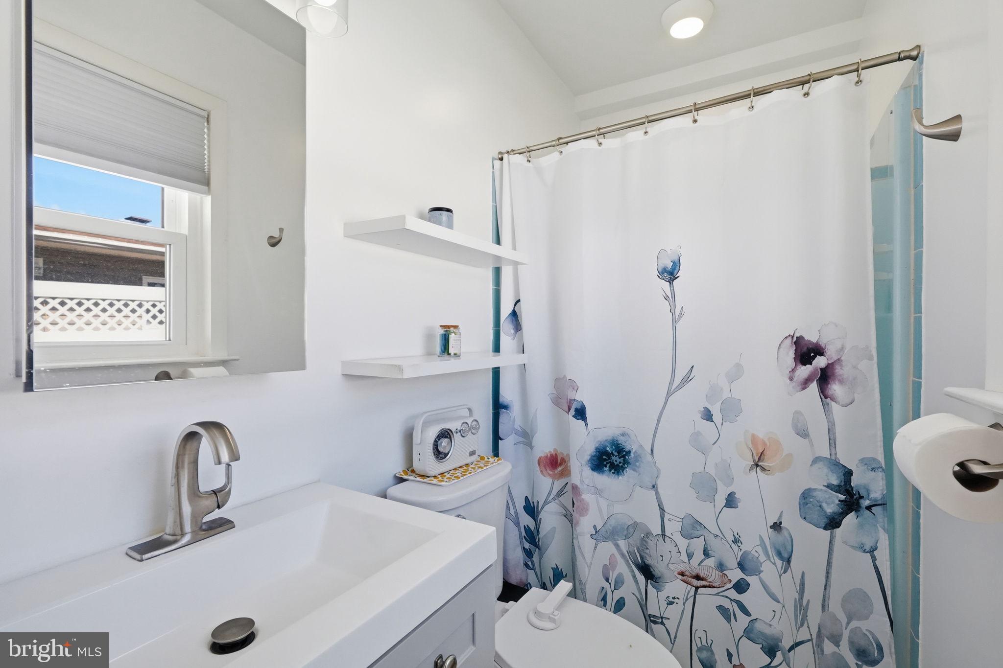 15 Deans Rhode Hall Road Monmouth Junction, NJ 08852 - Photo 16 of 24 a bathroom with a sink toilet and shower