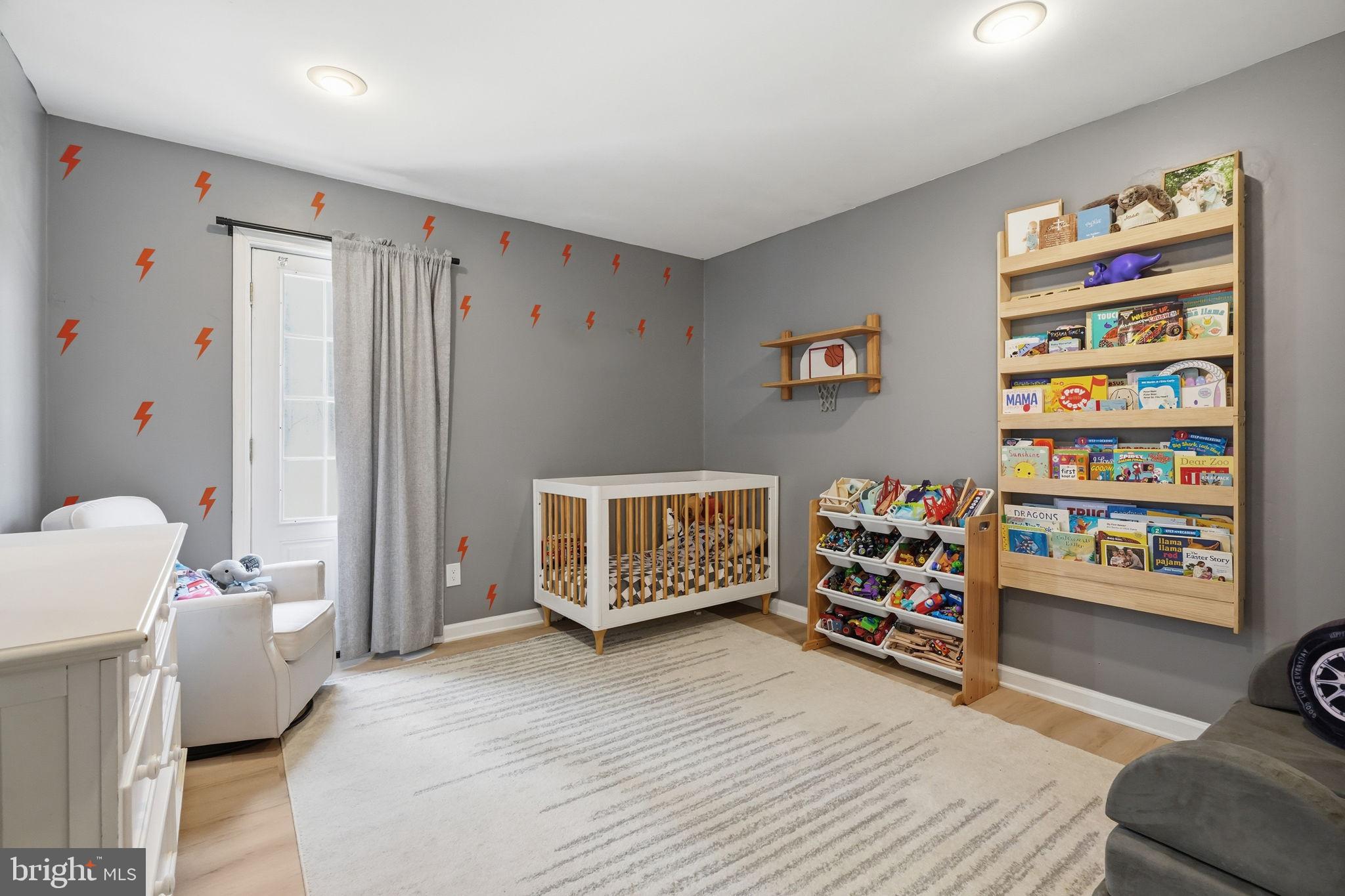 15 Deans Rhode Hall Road Monmouth Junction, NJ 08852 - Photo 17 of 24 a bedroom with furniture and a wooden floor