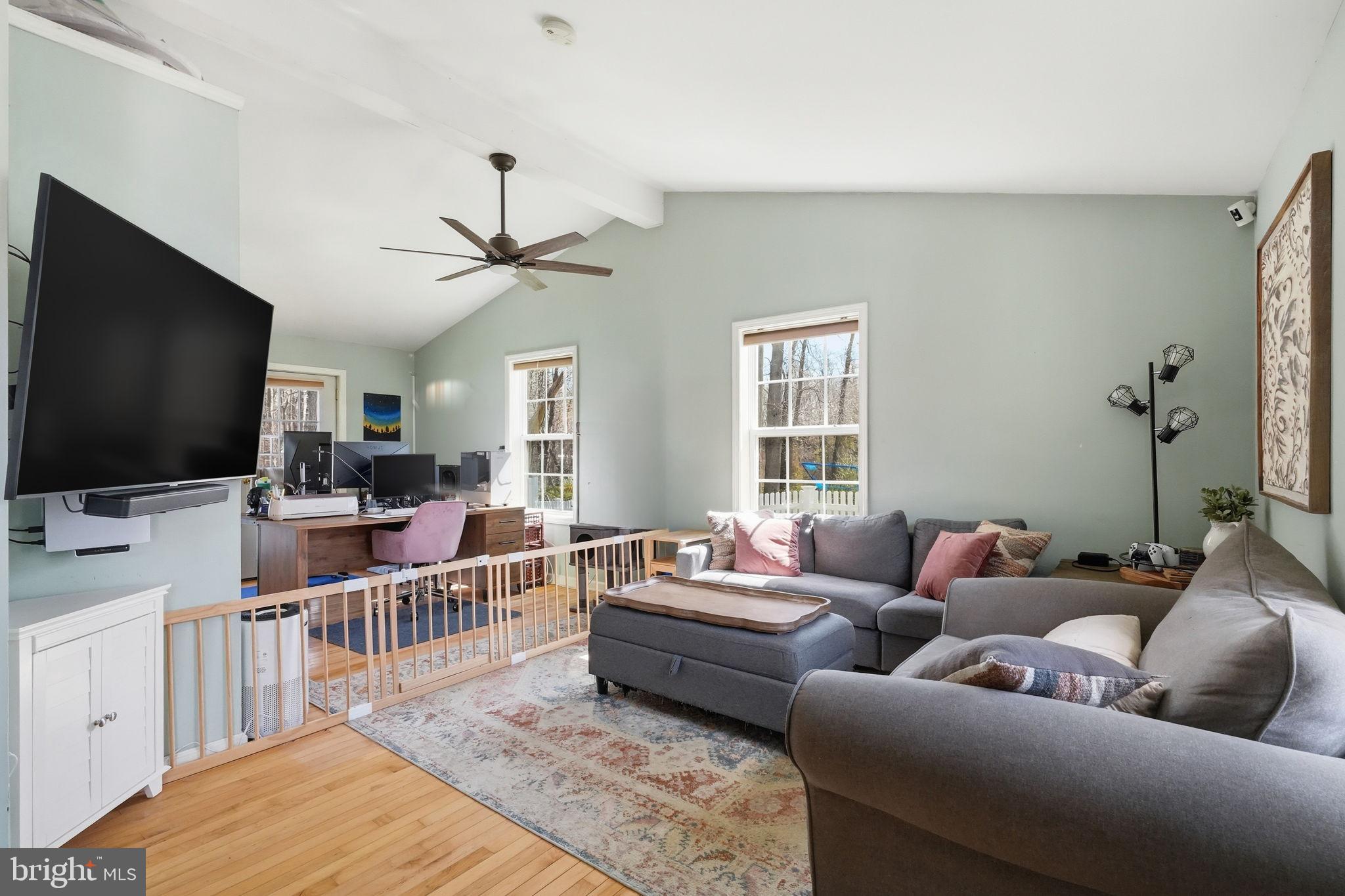 15 Deans Rhode Hall Road Monmouth Junction, NJ 08852 - Photo 21 of 24 a living room with furniture and a flat screen tv