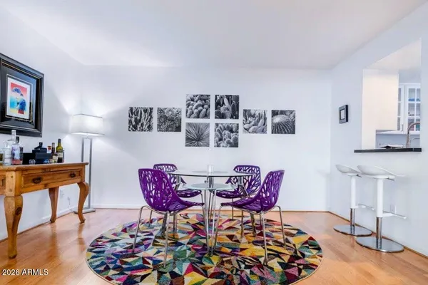 a view of a dining room with furniture and wooden floor
