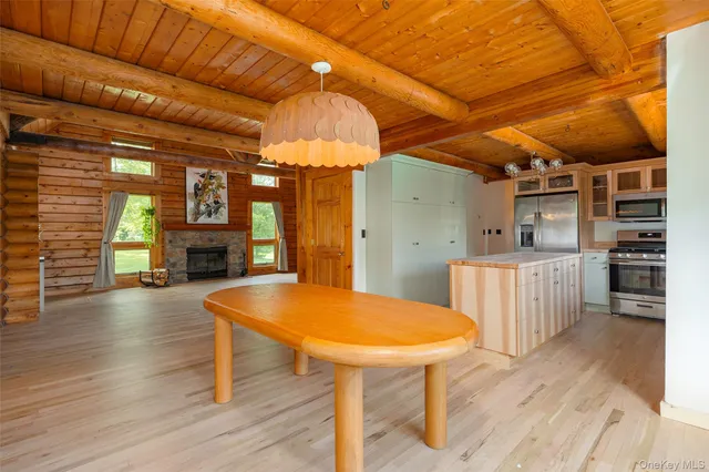 a view of outdoor space with wooden deck and seating