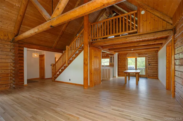 a view of a room with a table and chairs