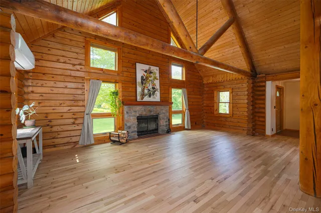 a view of livingroom with hardwood floor and a fireplace