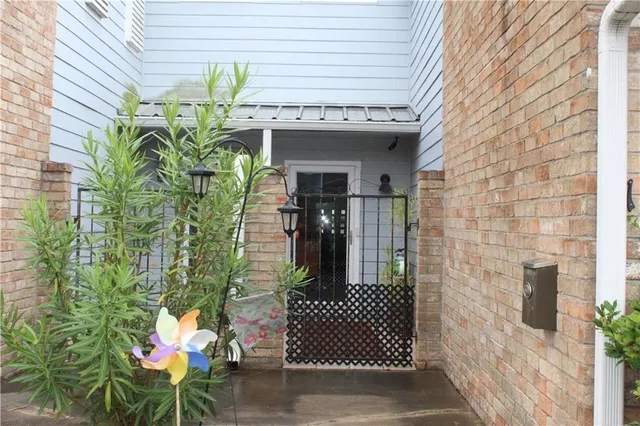 a front view of a house with outdoor seating