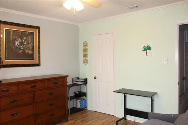 a view of room with furniture and wooden floor