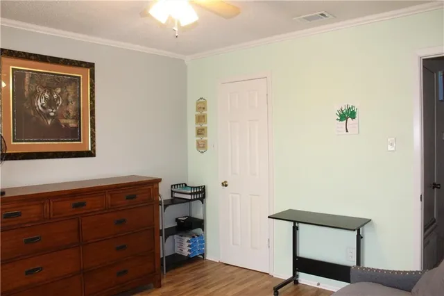 a view of room with furniture and wooden floor