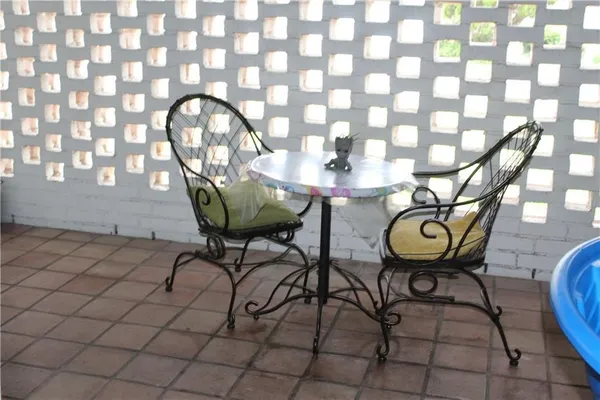 a view of entryway with table and chairs