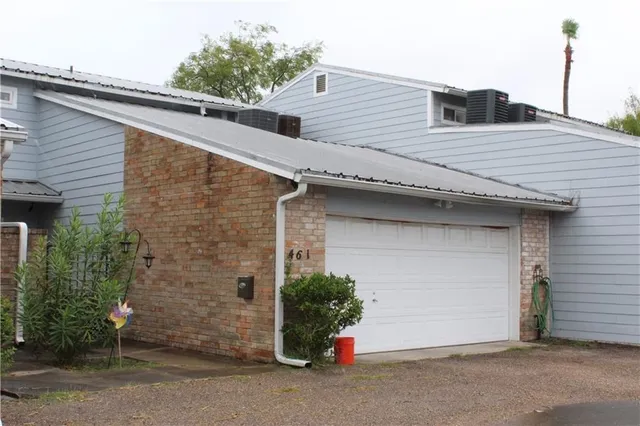 a front view of a house with a garage