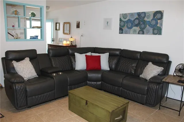 a living room with furniture and a couch