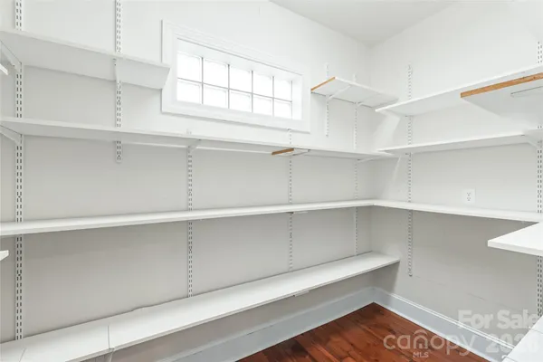 a view of cabinets and window