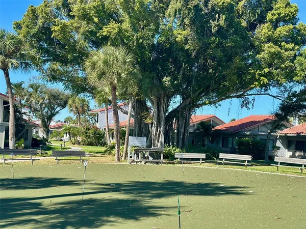 a view of pool with tree s