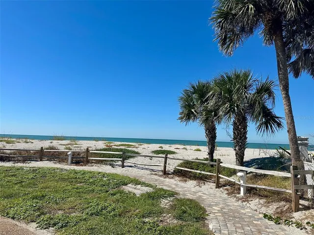 a view of a backyard with a lake view
