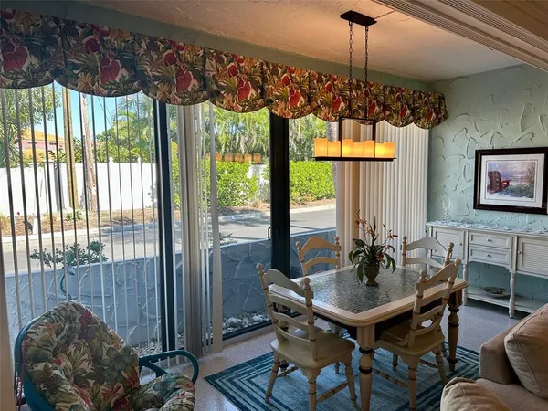 a view of a dining room with furniture window and outside view