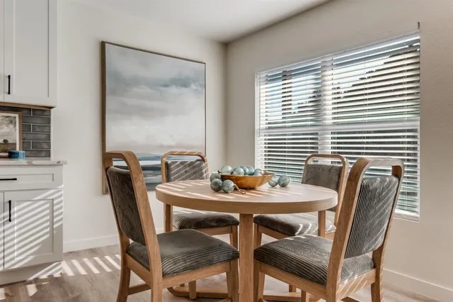 a view of a dining room with furniture and window