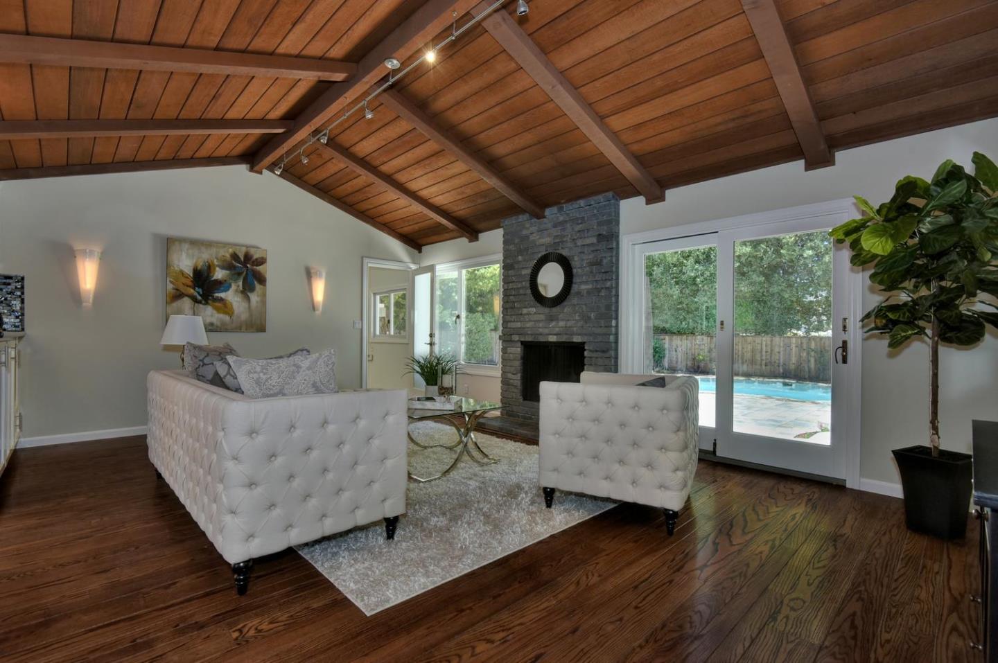 1031 Suffolk Way Los Altos, CA 94024 - Photo 11 of 26 a living room with furniture and a fireplace