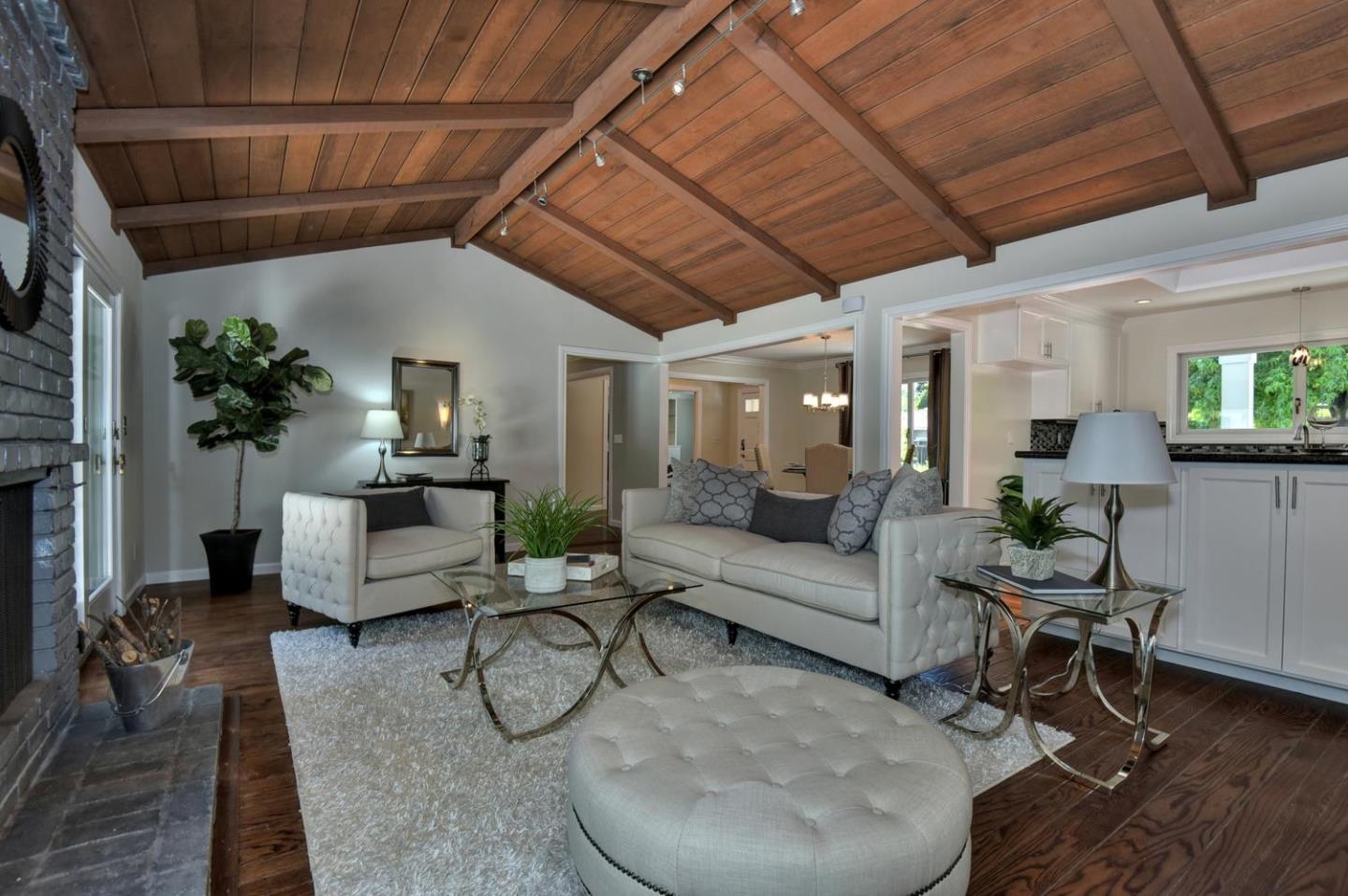 1031 Suffolk Way Los Altos, CA 94024 - Photo 12 of 26 a living room with furniture and a chandelier