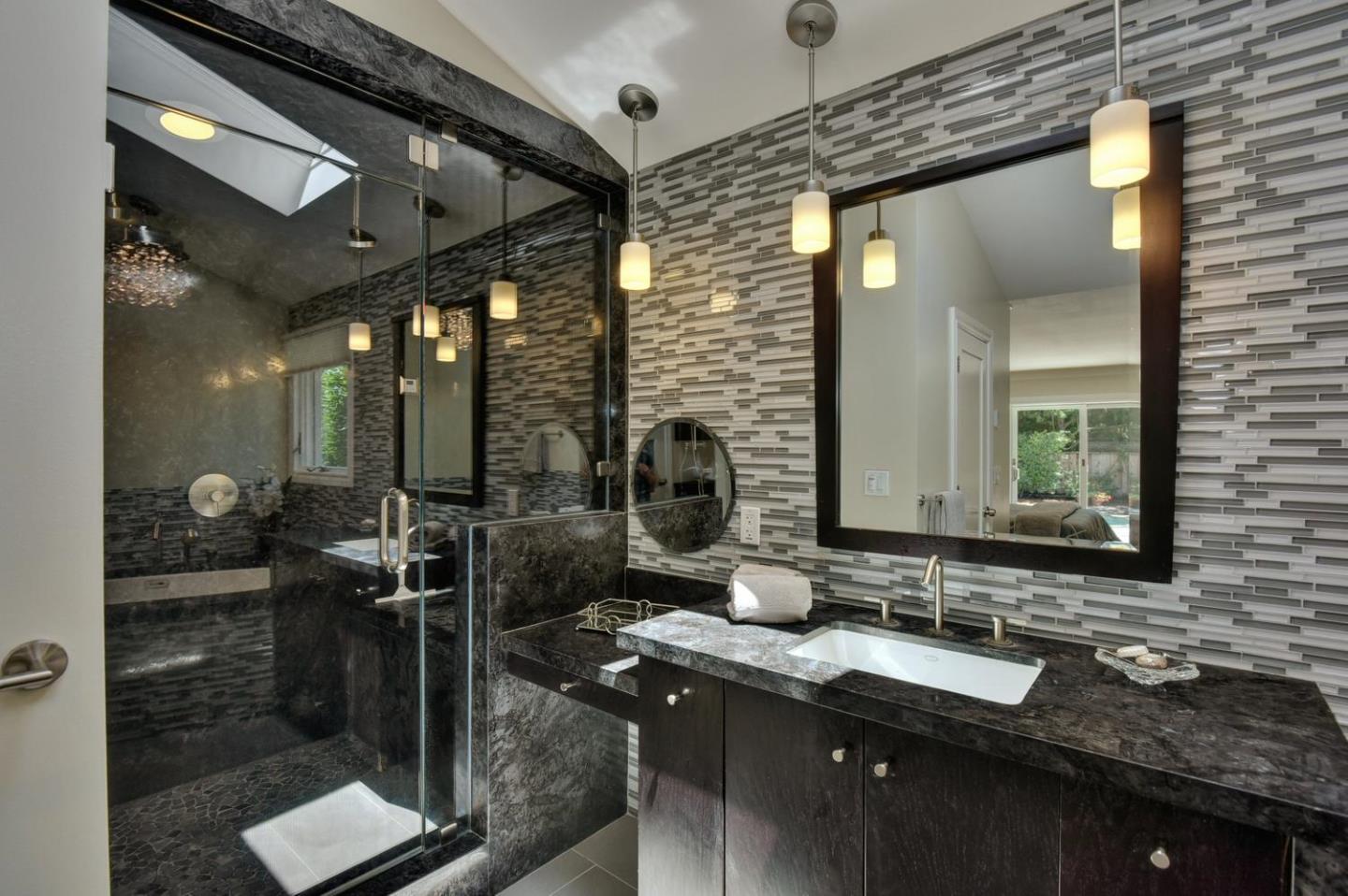 1031 Suffolk Way Los Altos, CA 94024 - Photo 16 of 26 a bathroom with a granite countertop sink a mirror and shower