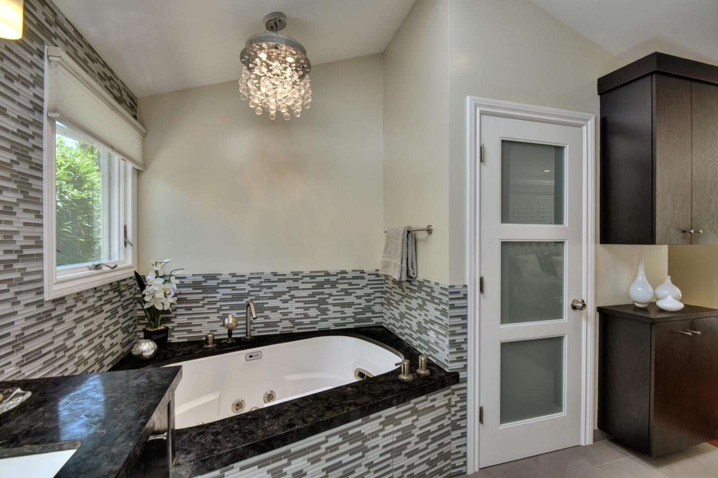 1031 Suffolk Way Los Altos, CA 94024 - Photo 17 of 26 a bath tub sitting in a bathroom next to a window