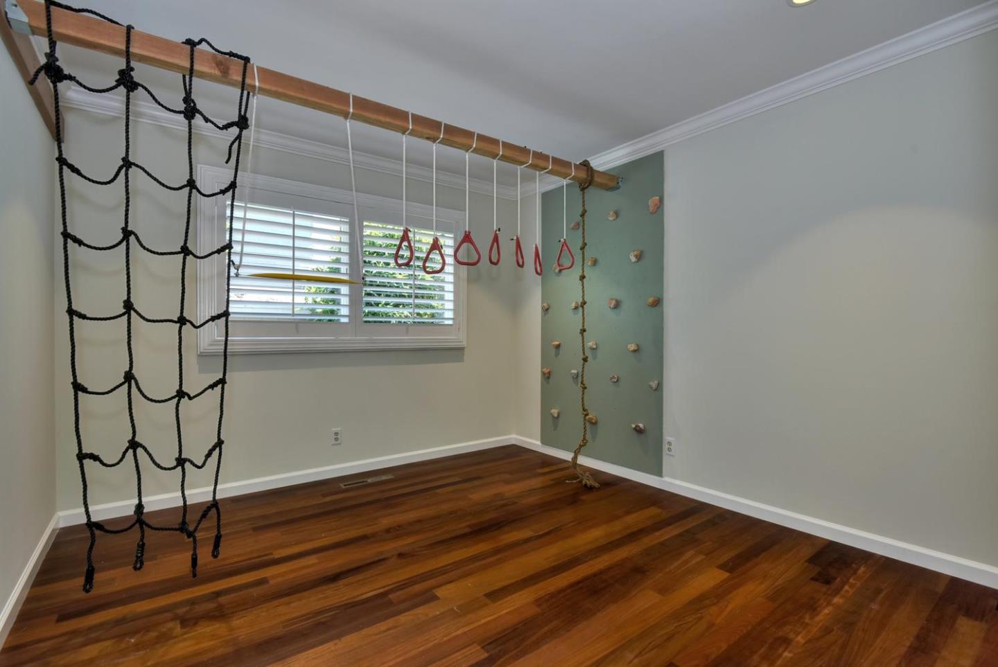 1031 Suffolk Way Los Altos, CA 94024 - Photo 18 of 26 a view of a room with wooden floor and a window