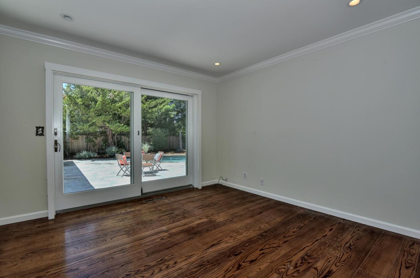 1031 Suffolk Way Los Altos, CA 94024 - Photo 20 of 26 a view of an empty room with wooden floor and a window