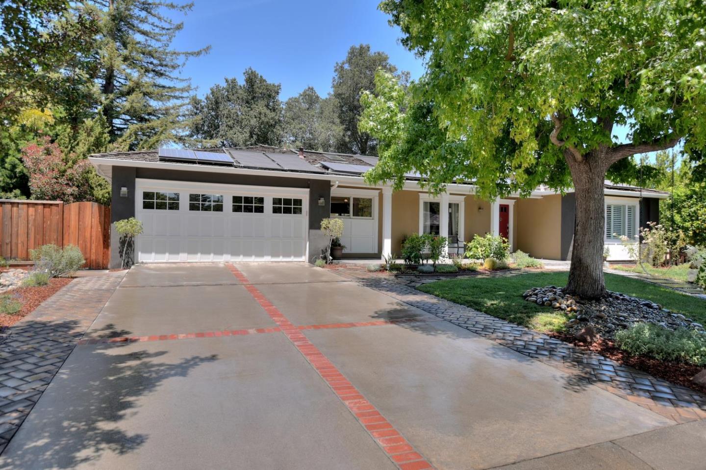 1031 Suffolk Way Los Altos, CA 94024 - Photo 2 of 26 a front view of a house with a yard and trees
