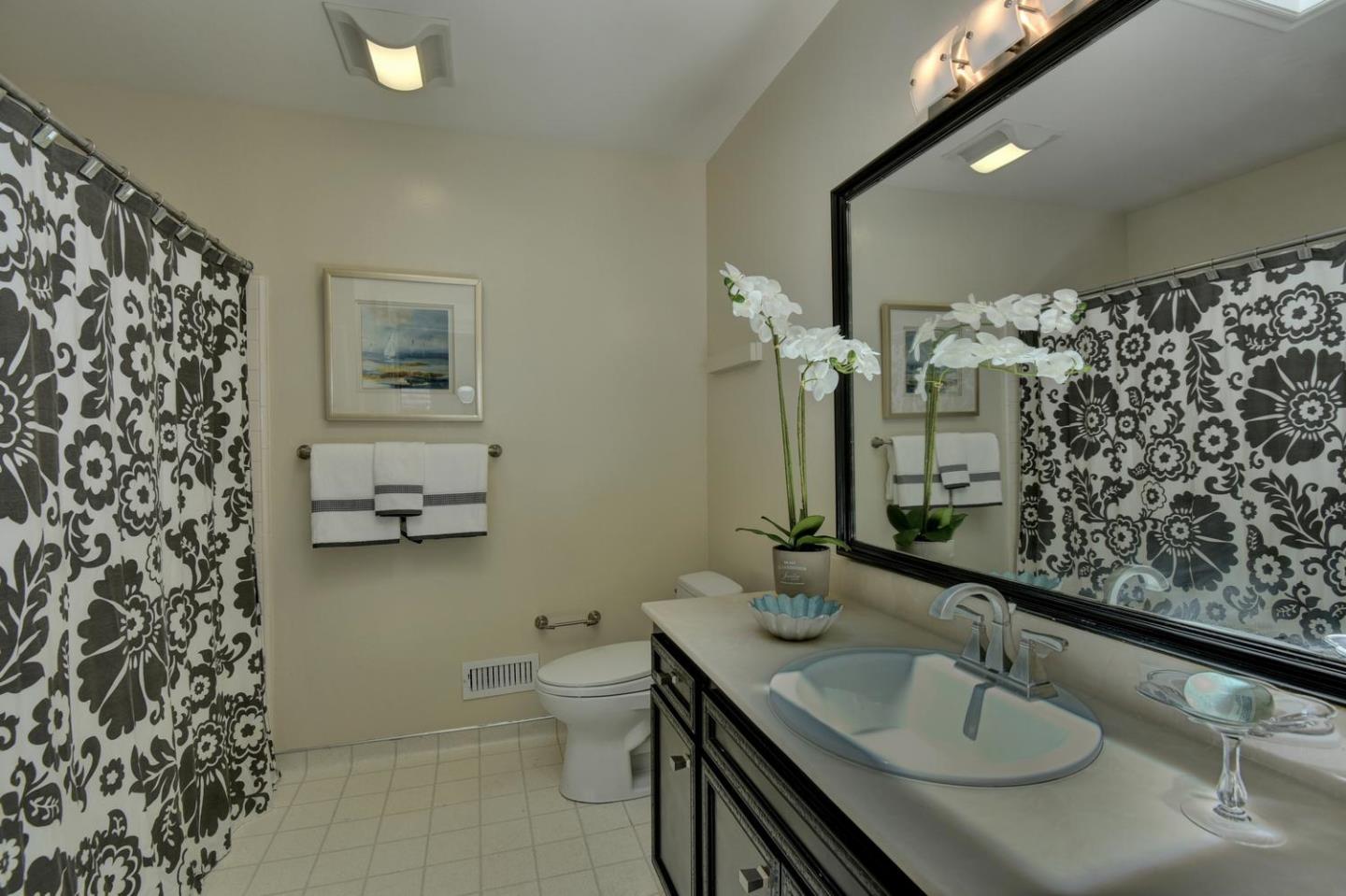1031 Suffolk Way Los Altos, CA 94024 - Photo 21 of 26 a bathroom with a granite countertop double vanity sink mirror and toilet