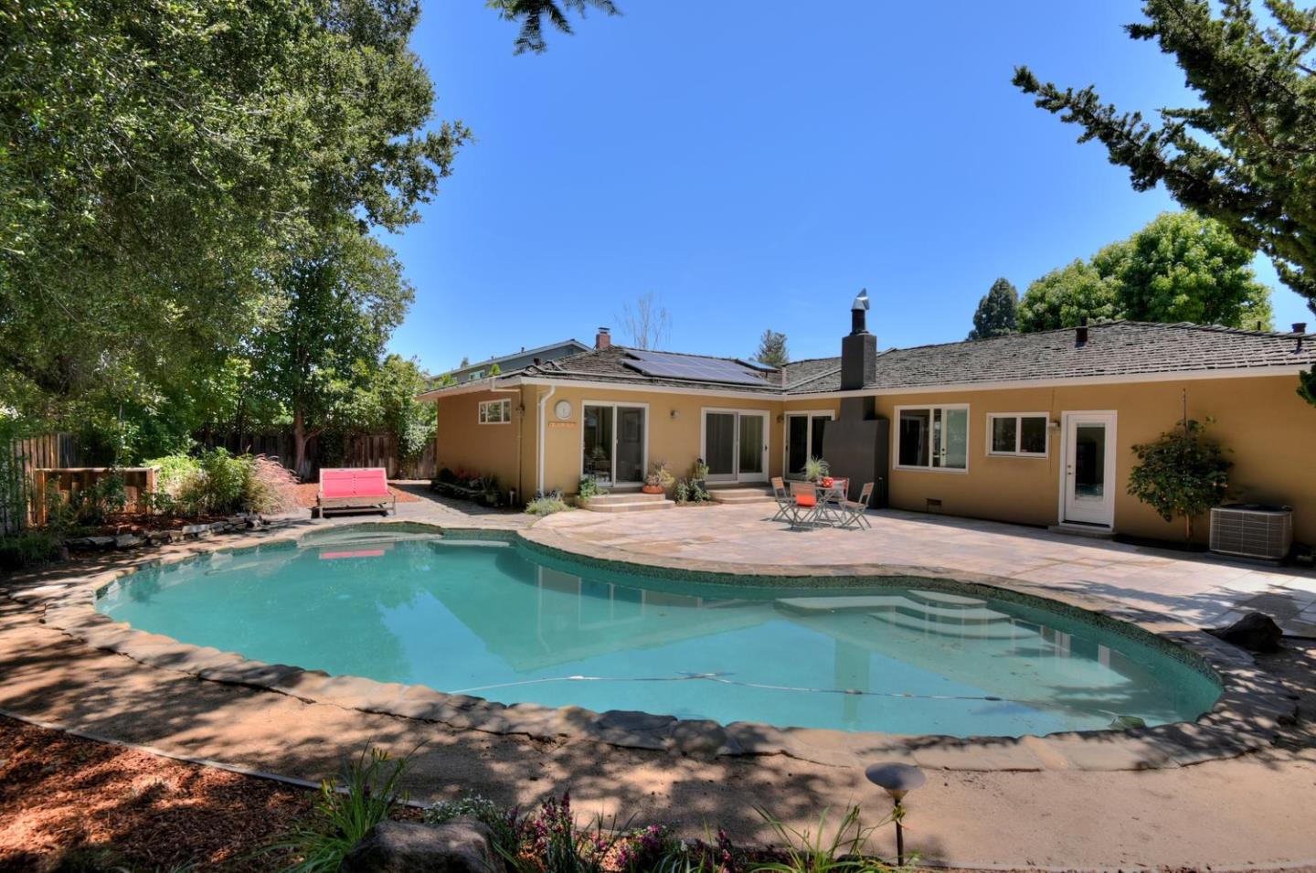 1031 Suffolk Way Los Altos, CA 94024 - Photo 26 of 26 a front view of a house with swimming pool having outdoor seating