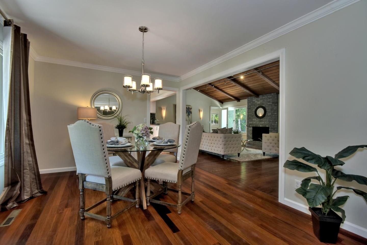 1031 Suffolk Way Los Altos, CA 94024 - Photo 9 of 26 a view of a dining room with furniture a chandelier and wooden floor