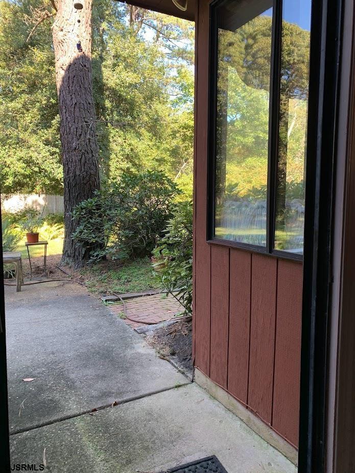 16 Greenbriar Road Marmora, NJ 08223 - Photo 22 of 37 a view of a porch with furniture and yard