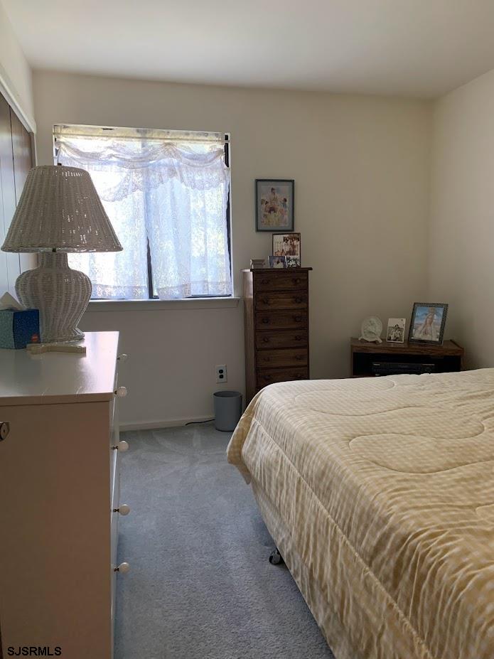 16 Greenbriar Road Marmora, NJ 08223 - Photo 28 of 37 a bedroom with a bed and a window