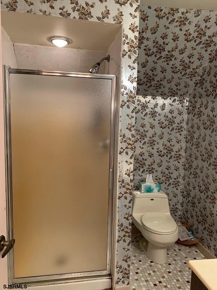 16 Greenbriar Road Marmora, NJ 08223 - Photo 30 of 37 a bathroom with a toilet and a shower