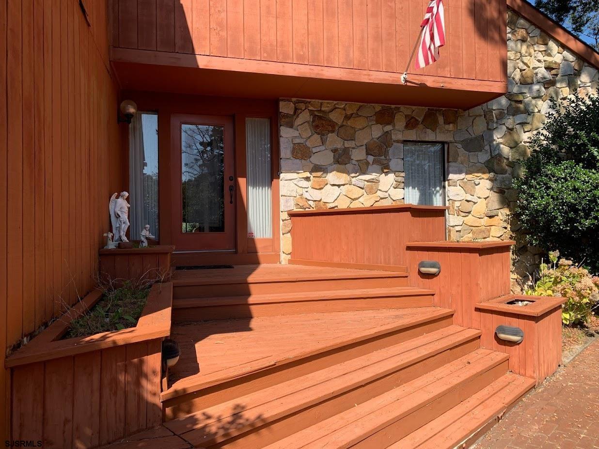 16 Greenbriar Road Marmora, NJ 08223 - Photo 4 of 37 a view of a entrance door of the house
