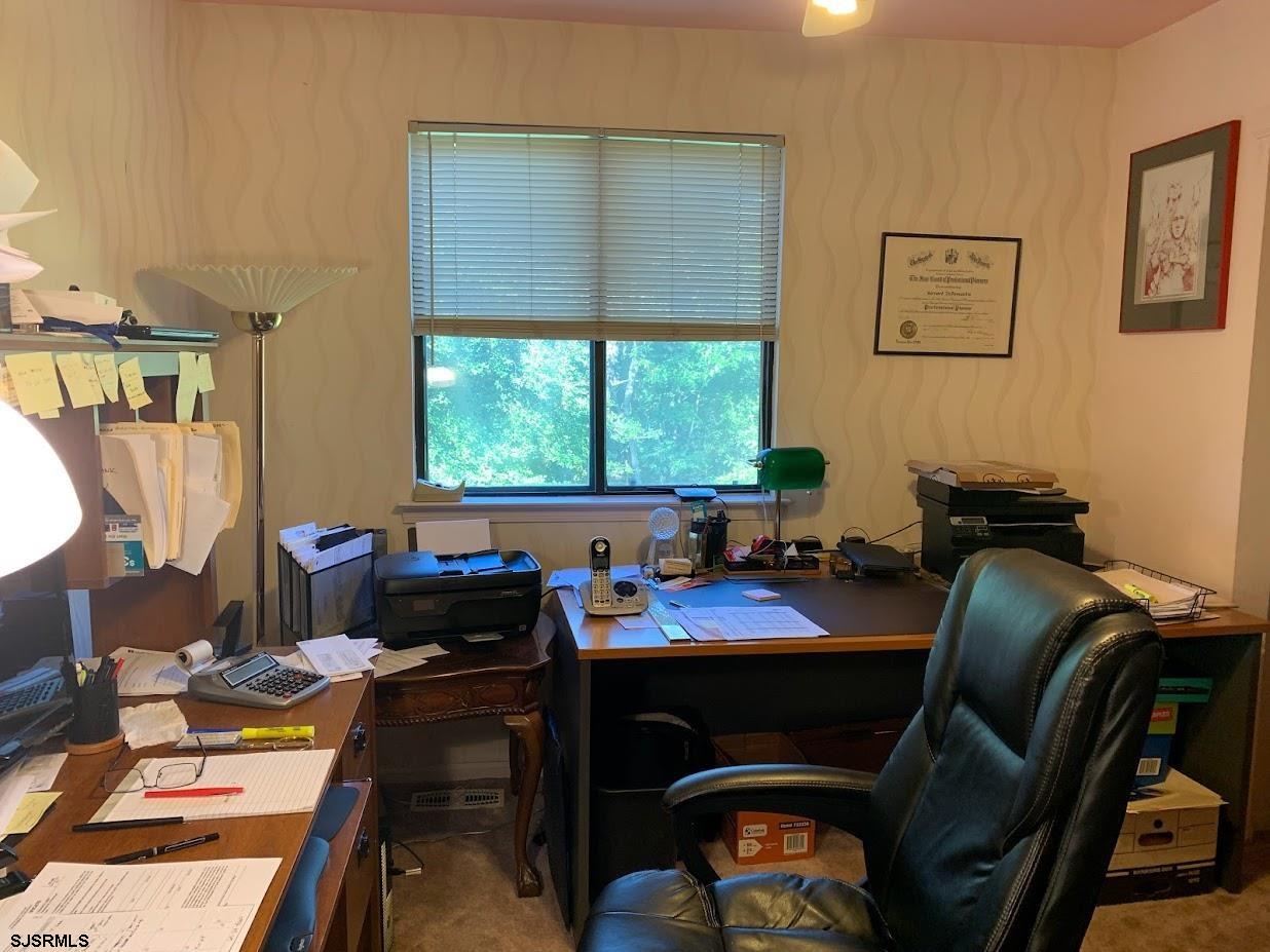 16 Greenbriar Road Marmora, NJ 08223 - Photo 31 of 37 a view of a workspace with furniture and a window