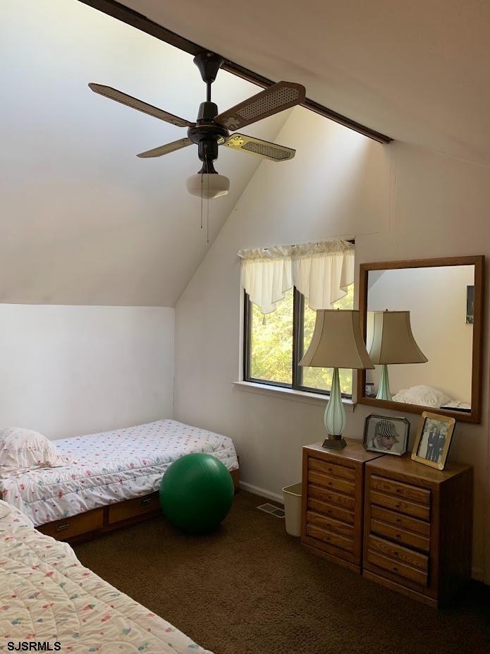 16 Greenbriar Road Marmora, NJ 08223 - Photo 32 of 37 a bedroom with a bed and a mirror