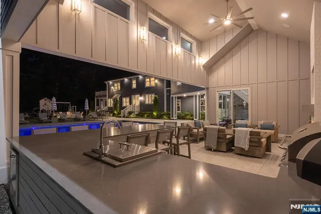 a living room with fireplace furniture and a flat screen tv