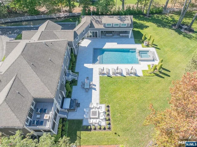 a view of swimming pool with a yard
