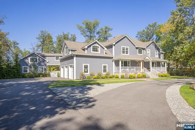 a front view of a house with a yard and porch